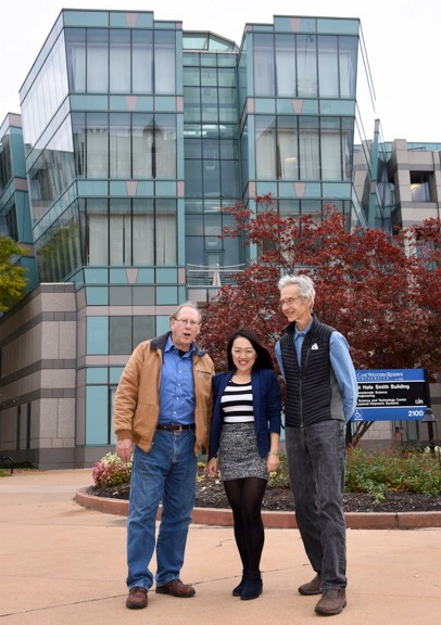 John E. Maher, Dr. Lu Han, Hugh Karraker in front of the fabulous Macromolecular Science and Engineering Building