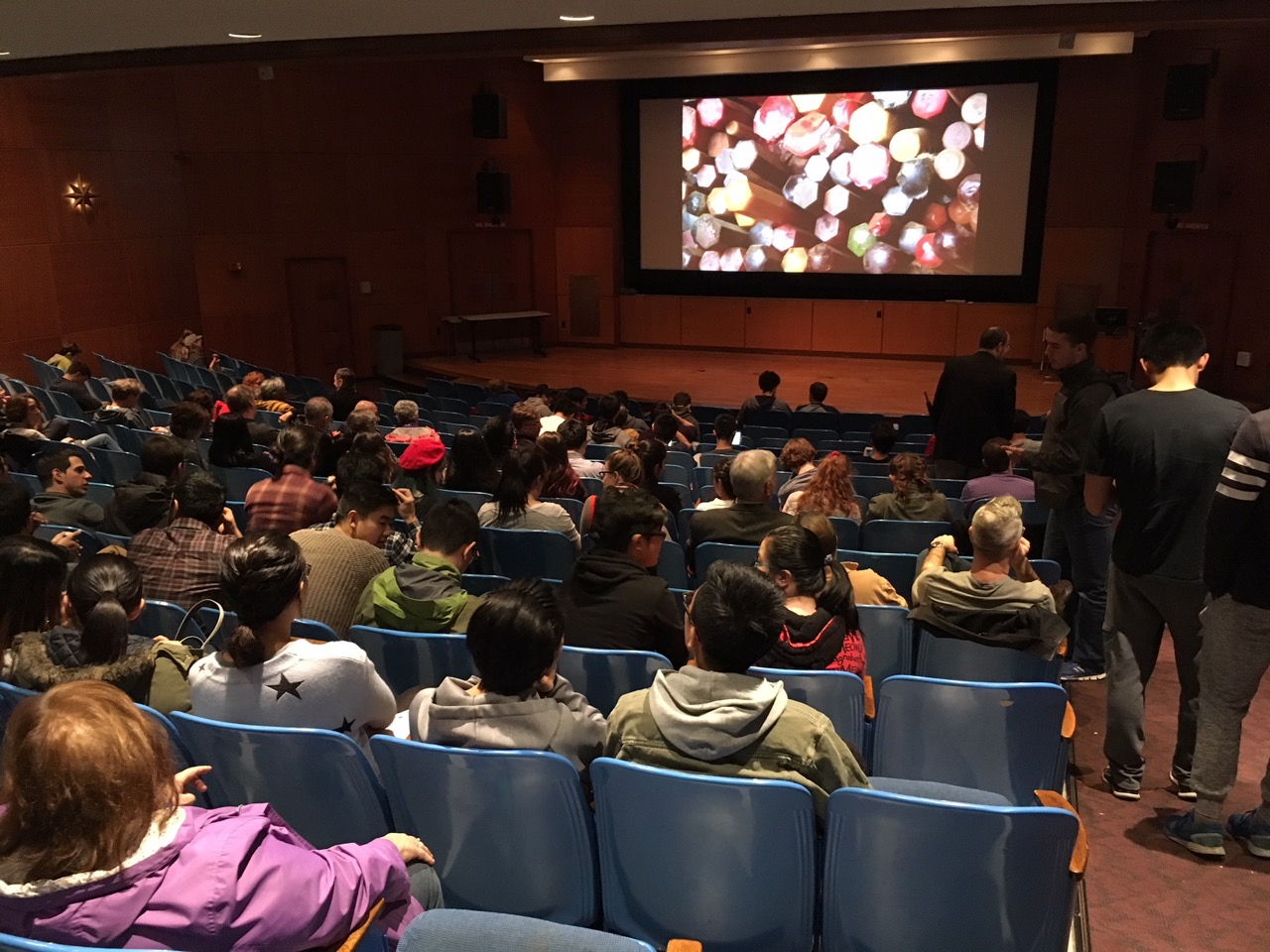 Audience taking their seats in Strosacker Auditorium