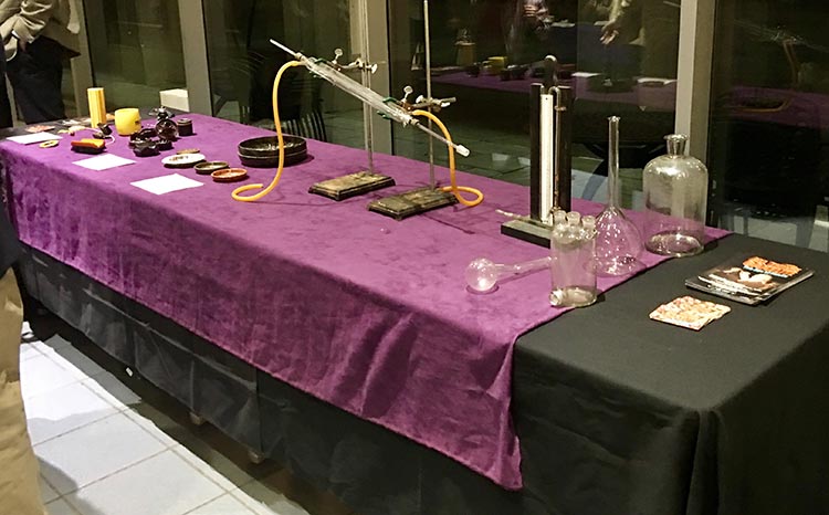 A table in the lobby displaying Baekeland laboratory glassware and a manometer. Included are Baekeland family heirlooms and present day Bakelite electrical and automobile parts. 